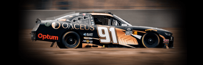 Oaceus-sponsored NASCAR Xfinity Series car #91 driven by Josh Williams, in Oaceus livery on the track.